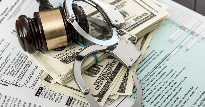 money gavel handcuffs tax forms